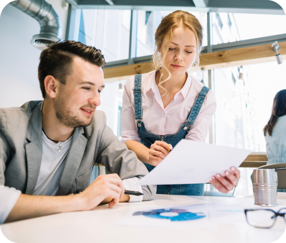 collaborating-man-woman-with-papers 1