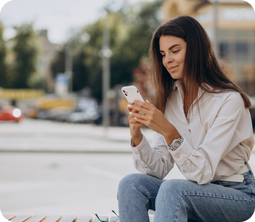 young-woman-talking-phone-outside-street (1) 1